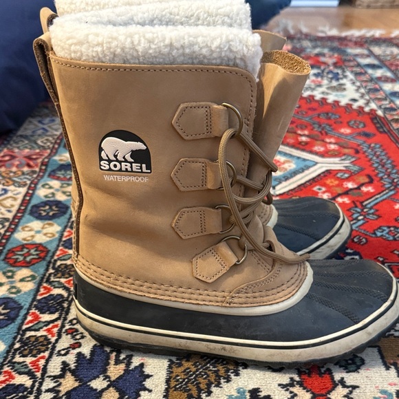 Sorel Tan and Black Winter Boots